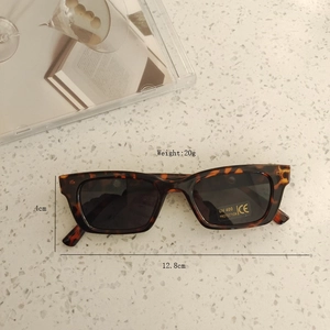 Detail view of tortoiseshell kids sunglasses with 12.8cm frame width and UV400 protection