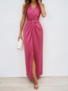 Detail of elegant magenta V-neck sleeveless dress with twist waist and high side slit