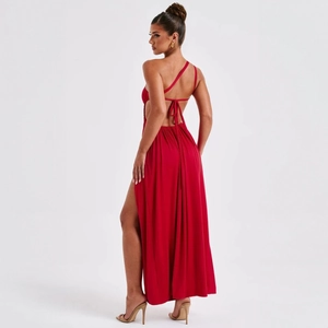 Detail of deep red dress showing the back lace-up design and elegant high side slit