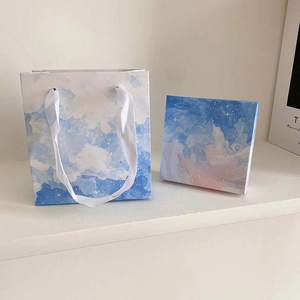 Elegant jewelry gift box and matching paper bag with dreamy oil painting sky pattern