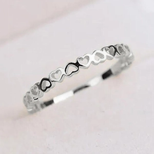 Minimalist hollow heart-shaped silver ring for women featuring a continuous band design