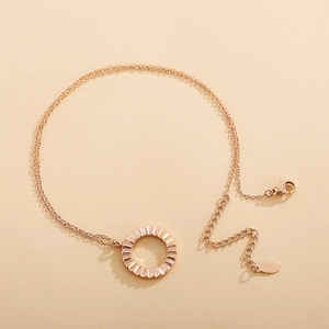 Rose gold stainless steel double-chain bracelet featuring a textured round pendant charm