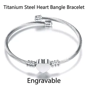 Polished silver stainless steel cable bracelet with customizable heart pendant charm