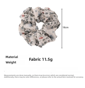 Detail of Chinese calligraphy scrunchie showing 18cm diameter and 11.5g weight
