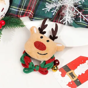 Christmas reindeer plush scrunchie with red nose and decorative bells on festive background