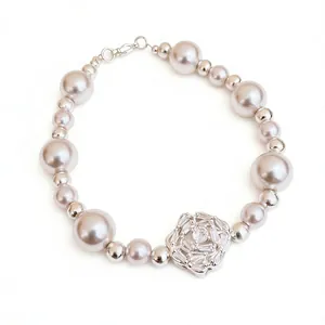 Elegant beaded pearl bracelet featuring a flower pendant with sparkling zircon stones