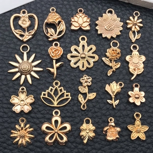 Detailed view of 20 pieces gold flower charms including roses and sunflowers for DIY jewelry