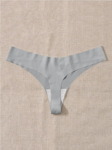 Detail of seamless grey thong with soft cotton lining and laser-cut edges on linen