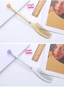 Detail of comb-shaped pens in gold and silver with diamond crystal tops and fine teeth
