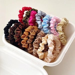 Multi-colored satin silk hair scrunchies set displayed in a creative white gift box