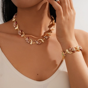 Exotic vintage gold necklace and bracelet set with red enamel flowers and zircons