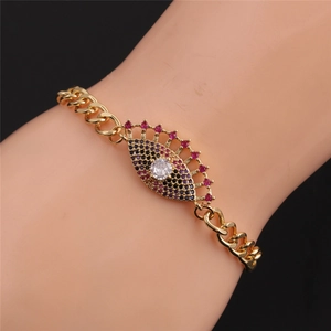 Detail of gold-plated evil eye bracelet with colorful zircons and Cuban chain links