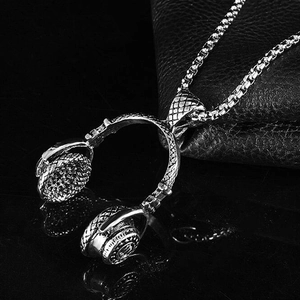 Silver headphone pendant necklace in titanium steel, stylish rock style on leather surface