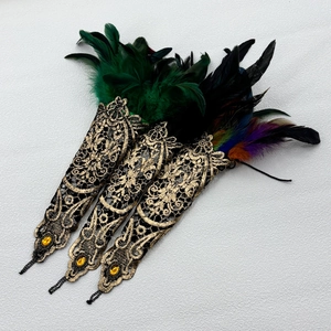 Gothic lace finger cuffs with colorful feathers, gold embroidery, and amber gemstones
