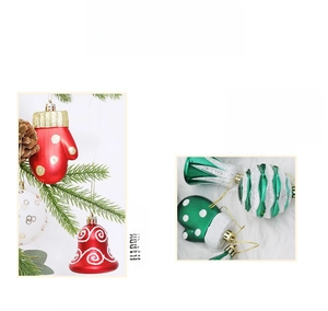 Detailed close-up of festive red and green glove-shaped ornaments and glittery baubles