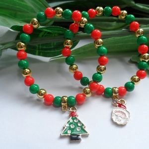 Festive Christmas beaded bracelet with Santa and tree charms on green pine branches