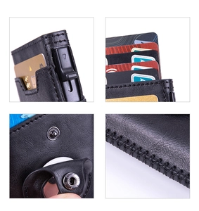 Detail view of leather AirTag wallet showing pop-up card slot and premium stitching