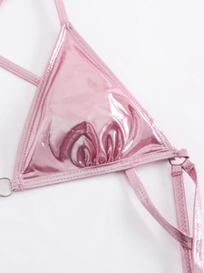 Detail of pink metallic one-piece swimsuit with silver metal rings and stitching