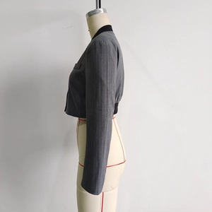 Side view of gray pinstripe cropped blazer on mannequin showing high-quality wool blend fabric