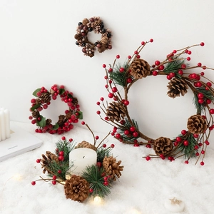Christmas berry and pinecone wreath candle holder centerpiece with artificial red berries