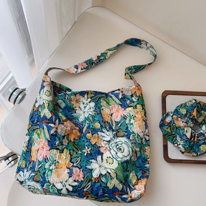 Floral canvas tote bag set with matching hair scrunchie shown in aesthetic lifestyle view