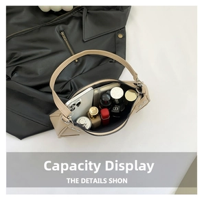Interior view showing the large capacity of this apricot baguette bag for daily essentials