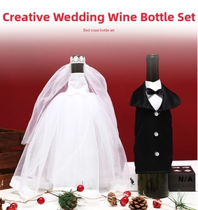 Wedding wine bottle covers set with white lace bridal gown and black groom tuxedo detail
