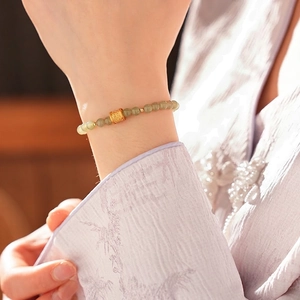 Elegant Chinese style artificial Hetian jade beaded bracelet with golden cylinder charm