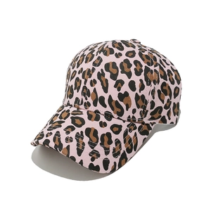 Close-up of pink leopard print baseball cap featuring cotton twill texture and curved brim