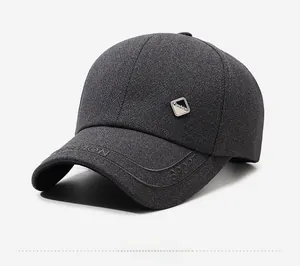 Detail of dark grey baseball cap featuring herringbone texture and SPORT embroidery