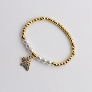 Chic butterfly charm bracelet with gold beads, pearls and colorful zircon stones