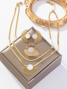 Detailed set of fan-shaped cutout gold titanium jewelry with white shell in a gift box