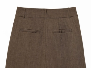 Close-up of high-waist dark brown trousers featuring belt loops and welt back pockets