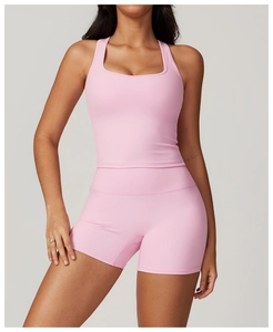 Close-up of pink racerback tank top and high-waist shorts set in matte stretch fabric