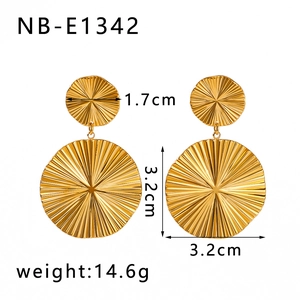 Detail view of large pleated fan textured 18K gold plated stainless steel drop earrings