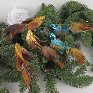 Set of 6 blue and gold bird Christmas ornaments with feathers and sequins on pine needles