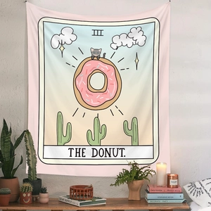 Detail of Bohemian tarot wall tapestry featuring a cute cat on a donut in a room setting