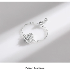 Detail of S925 sterling silver drop pendant ring with sparkling cubic zirconia stones