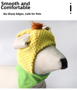 Detail view of yellow fleece pet hat with ear holes and plush pom-pom on dog model