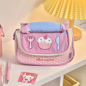 Detail of cute strawberry roll pencil case with cake embroidery and handle
