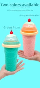 Detail of ice cream cone shaped slushy cups in green and pink with cherry lids