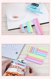 Macro view of macaron candy colored plastic food clips in two sizes for sealing kitchen bags
