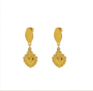Detail of gold heart earrings with vintage carved texture and oval stud in baroque style