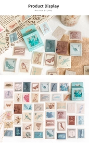 Flat lay of retro botanical stamp stickers and decorative green packaging box