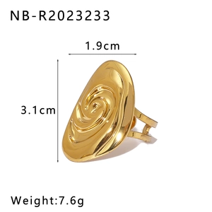 Macro shot of large 18K gold stainless steel ring with oval spiral design and dimensions