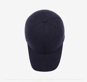 Top view of navy blue wool baseball cap showing premium knit texture and stitching detail