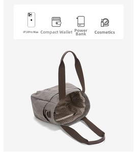Detail of gray canvas tote capacity with brown straps and striped lining for daily essentials