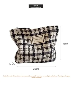 Size guide showing 26cm x 18cm dimensions for the plaid tweed cosmetic bag