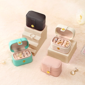 Compact PU leather jewelry organizer boxes in black, mint, cream, and pink colors