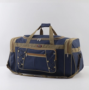 Detail of large capacity travel duffel bag showing durable blue oxford fabric and pockets